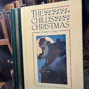 May include: A hardcover book titled "The Child's Christmas" by Evelyn Sharp, illustrated by Charles Robinson. The cover features a painting of Santa Claus and a night scene. The spine is green with gold detailing.