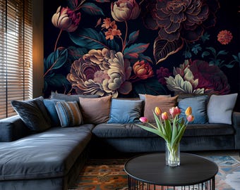 May include: A living room with a dark blue sectional sofa and a black coffee table. The wall behind the sofa is covered in a dark floral wallpaper with large, colorful flowers. A vase of pink and yellow tulips sits on the coffee table.
