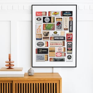 May include: A collage of vintage matchboxes featuring various logos and designs, including the University of Georgia, Andy's, Boar's Head, and Chuck's. The matchboxes are arranged in a grid pattern on a white background.