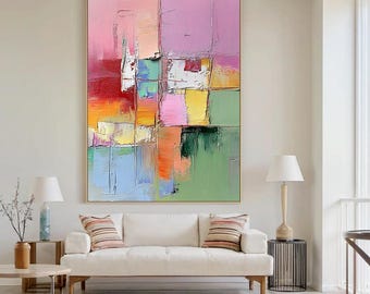 Puede incluir: Pintura al óleo abstracta con marco dorado. La obra presenta una vibrante mezcla de colores, incluyendo rosa, rojo, naranja, amarillo, verde y azul. Las pinceladas son gruesas y texturizadas, creando una obra de arte dinámica y expresiva.