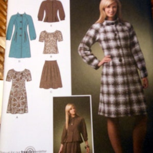 May include: Simplicity sewing pattern 2764 featuring various women's clothing designs. The pattern includes a coat, top, skirt, and dress. The main image shows a woman wearing a plaid coat and dress. The pattern's color scheme includes teal, brown, and white.