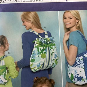 May include: Image of a sewing pattern featuring three floral-patterned bags: a backpack, a tote bag, and a smaller backpack. The bags have blue, green, and white floral designs. The backpacks have striped straps and green bows.