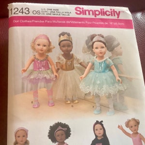 May include: Simplicity pattern 1243 for doll clothes. The pattern includes designs for doll outfits, including tutus and dresses. The dolls are approximately 18 inches (45.5cm) tall. The pattern is labeled "U.S. ONE SIZE".