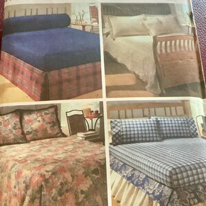 May include: A magazine cover featuring four bedding sets. The sets include a navy blue bed with a plaid bed skirt, a white bed with a wooden headboard, a floral bedspread, and a blue plaid bed with a ruffled skirt. The text "design your own easy bedding essentials" is visible.