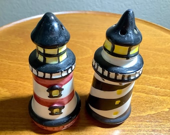 Lighthouses Salt & Pepper Shakers | 3.25” tall | Great Condition one missing stopper as pictured