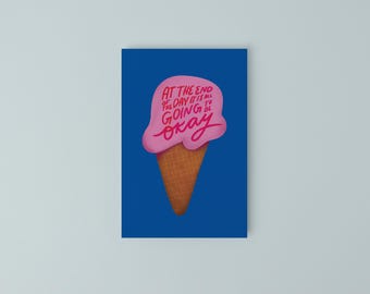 May include: A blue wall art print featuring a pink ice cream cone with the text "AT THE END OF THE DAY IT IS ALL GOING TO BE OKAY" in pink script. The ice cream cone has a waffle cone base.