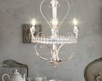 Vintage-Inspired Metal Chandelier with Elegant Floral Design and Four Lights, Distressed White Finish for Charming Home Decor.