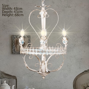 Elegant Four-Light Metal Chandelier with Intricate Floral Details, Vintage Shabby Chic Hanging Light for Dining Room or Living Space.