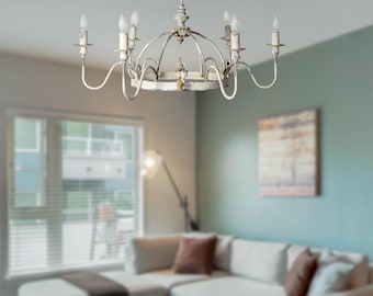 May include: A white, distressed metal chandelier with six candle-style light bulbs. The chandelier has a circular design with a decorative, ornate center piece.