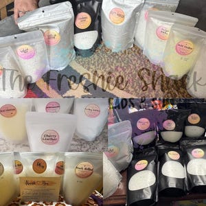 May include: A variety of bath salts in clear plastic bags with labels. The labels include names like "Cherry Leather", "Sweet Grace", "Jax Teller", "Blue Cotton", "Black Belted", and "Dia". The Freshie Snack is written across the image.