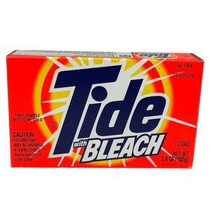 May include: A box of Tide laundry detergent with bleach. The box is red with a white and yellow burst design. The Tide logo is in large blue letters. The box contains 102g of detergent.
