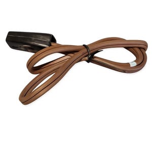 May include: A brown electrical power cord featuring a black plug head at one end. The cord is coiled into a figure-eight shape and secured with a small black plastic zip tie. The cable has a smooth, matte finish and a standard two-prong plug design.