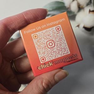 May include: A square magnet with an orange and red gradient background. The magnet features a QR code and the Instagram logo, with the text "Follow Us on Instagram." The bottom of the magnet reads "chick magnets magnetic photos."