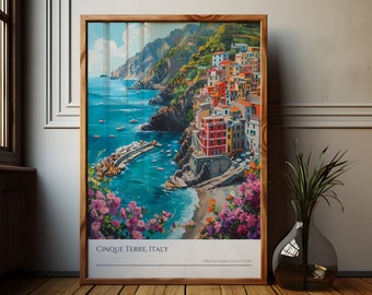 May include: A colorful painting of the Cinque Terre region of Italy, featuring a picturesque coastal town with colorful buildings, a rocky coastline, and a blue sea. The painting is framed in a wooden frame and has the text "Cinque Terre, Italy" and "Destinations Collection" at the bottom.