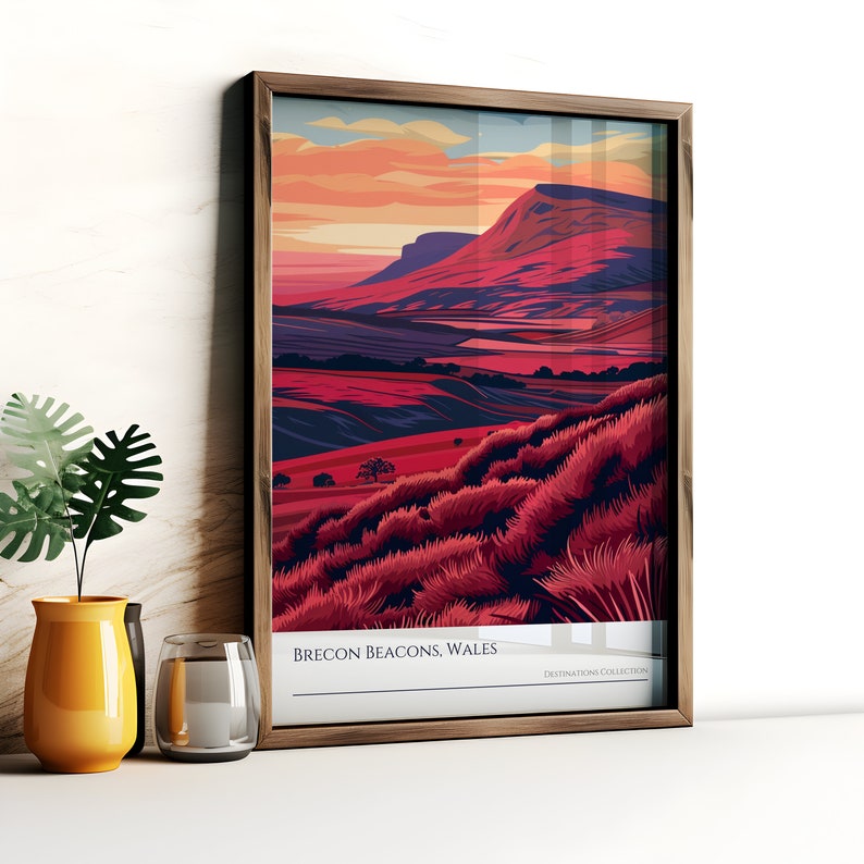 May include: A framed illustration of a mountain range with a red, orange, and purple color scheme. The text "Brecon Beacons, Wales" is at the bottom of the image.