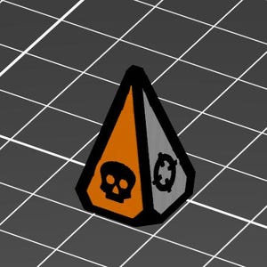 Może przedstawiać: Trójwymiarowy obiekt w kształcie piramidy w kolorze pomarańczowym, szarym i czarnym, z symbolem czaszki i skrzyżowanych piszczeli oraz symbolem celu. Obiekt umieszczony na szarym tle w kratkę.