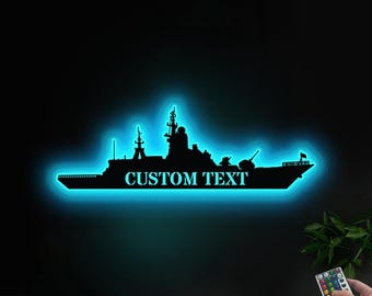 May include: A blue neon light shaped like a warship with the text "CUSTOM TEXT" on the side.