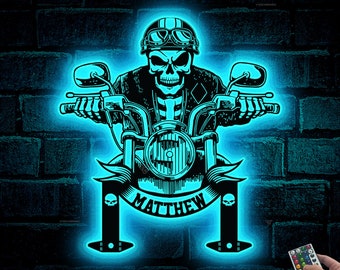 May include: A blue neon light with a skull riding a motorcycle. The motorcycle has a banner that says "MATTHEW".