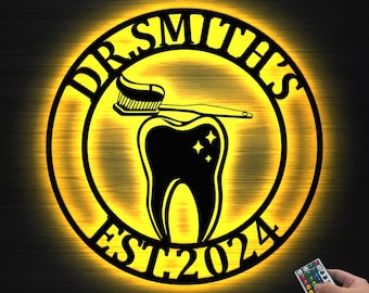 May include: A round, illuminated sign with the text "DR. SMITH'S" in a circular pattern. The sign features a toothbrush over a tooth with stars, and the text "EST 2024". The sign is lit with a warm yellow glow.