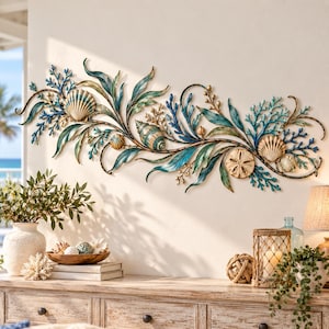 May include: A horizontal metal wall art piece featuring a coastal theme with sculpted seashells, sand dollars, and coral branches. The design incorporates flowing leaves and vines in shades of teal, blue, and metallic gold, creating a decorative display.