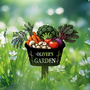 May include: A black metal garden stake with a basket filled with vegetables and mushrooms. The stake has the text "Oliver's Garden" on it.