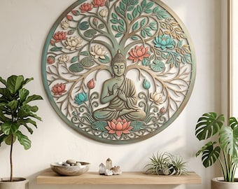 May include: A circular wall art piece featuring a central Buddha figure in a meditative pose, surrounded by an intricate tree with branches, leaves, and lotus flowers in shades of pink, teal, and cream, all enclosed within a circular frame.