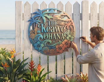 May include: A circular metal wall sign featuring a gradient of blue, green, and orange colors. The sign displays the text "THE Keawe OHANA" surrounded by cut-out designs of palm trees, hibiscus flowers, ocean waves, and seashells.