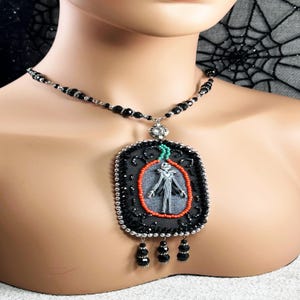 Hand beaded Halloween necklace, orange, black, and silver, skeleton beads, would make a great gift for her for Halloween.