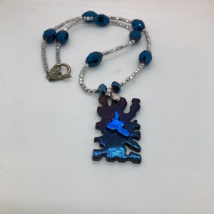 Silver and blue crystal necklace with dichroic pendant’, puzzle piece pendant, autism awareness, sparkle, evening or party necklace