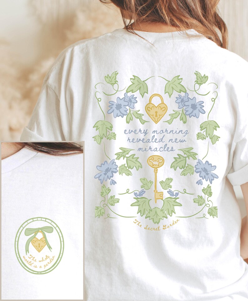 May include: White t-shirt with a floral design and the text "every morning revealed new miracles" and "The Secret Garden".