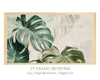 May include: A digital art print featuring a close-up of large, green monstera leaves against a light beige background. The leaves are arranged in a layered, overlapping pattern, creating a sense of depth and texture. The print is framed in a light wood frame.