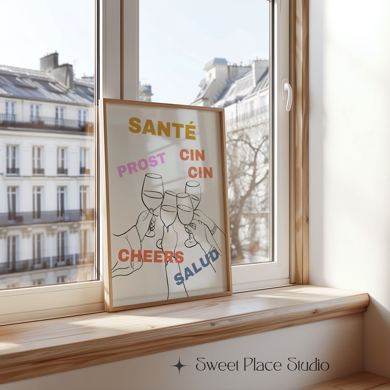 May include: A white poster with a black line drawing of five hands holding up wine glasses. The words "Sant&eacute;", "Prost", "Cin Cin", "Cheers", and "Salud" are written in different colours around the glasses.
