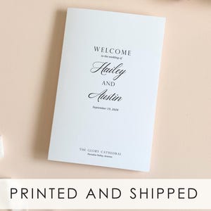 May include: A white wedding program with the text "WELCOME to the wedding of Hailey AND Austin September 19, 2028". The program is from "THE GLORY CATHEDRAL Paradise Valley, Arizona". The bottom of the program reads "PRINTED AND SHIPPED".