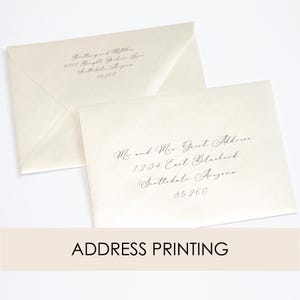 May include: Two white envelopes with black calligraphy address labels. The top envelope has the address "6000 Bright Garden Lane, Scottsdale, Arizona 85260". The bottom envelope has the address "Mr. and Mrs. Guest Address, 1234 East Blackbird, Scottsdale, Arizona 85260".