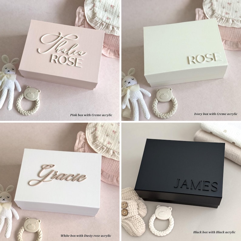 May include: Four square boxes in various colors: pink, ivory, white, and black. Each box has a name in a cursive font. The pink box says "Thalia ROSE", the ivory box says "ROSE", the white box says "Gracie", and the black box says "JAMES".
