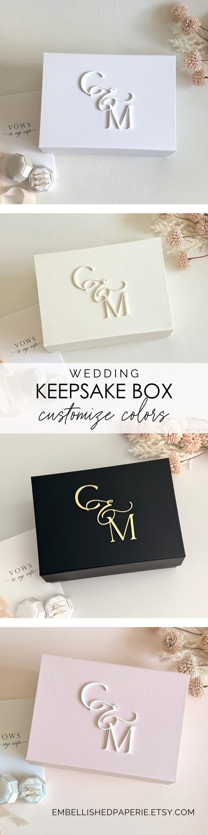 May include: A wedding keepsake box in white, black, and pink, with a custom monogram. The box features the text "C&M" in a decorative font. The image also includes the text "VOWS to my wife".