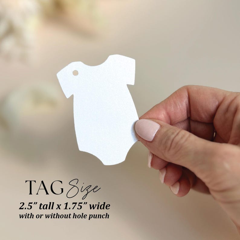 May include: White baby onesie shaped tag with a hole punch at the top. The tag is 2.5 inches tall and 1.75 inches wide. TAG Size 2.5" tall x 1.75" wide with or without hole punch.