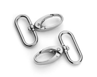 May include: Two silver metal swivel clasps with a D-ring on one end and a hook on the other end.