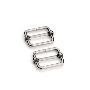 May include: Two silver metal slider buckles. The buckles are rectangular with rounded corners and have a smooth, polished finish.