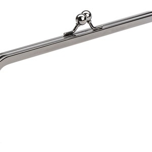 May include: A silver-toned metal purse frame with a double-loop closure and a rounded top.
