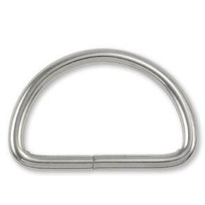 May include: A silver-toned metal D-ring with a smooth finish.