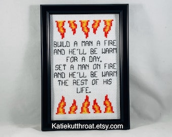 Build a man a fire and he’ll be warm for a day. Set a man on fire and he’ll be warm for the rest of his life. Funny Subversive Cross Stitch