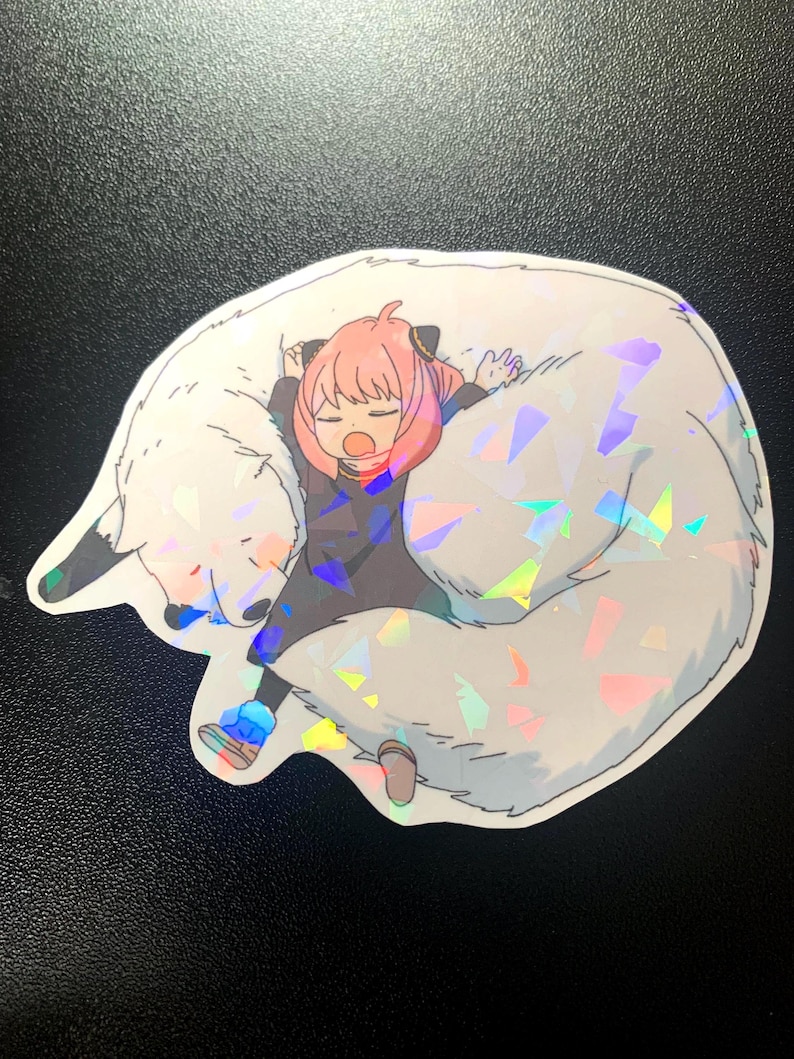 May include: A sticker featuring a cartoon girl with pink hair sleeping on a white furry animal with iridescent glitter. The girl is wearing a black shirt and blue trousers.
