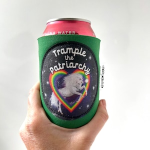 May include: Green can cooler with a white unicorn inside a rainbow heart and the text "Trample the Patriarchy".