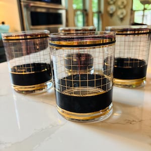 May include: A set of three ceramic mugs with a speckled, matte finish. The mugs are in shades of cream, light gray, and dark gray. Each mug has a simple, minimalist design, perfect for coffee or tea.