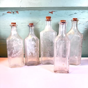 Bottiglie antiche in vetro trasparente con tappi di sughero: decorazioni americane - SCEGLI TU