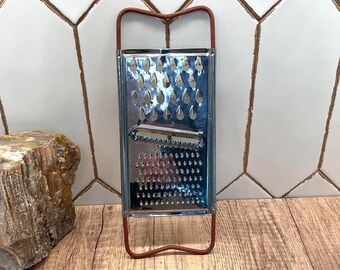 Vintage Flat Metal Kitchen Cheese Grater w/ Red Handle (circa 1950s–1970s)