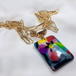 Colorful rectangular polymer clay pendant necklace, complete with long gold-plated chain