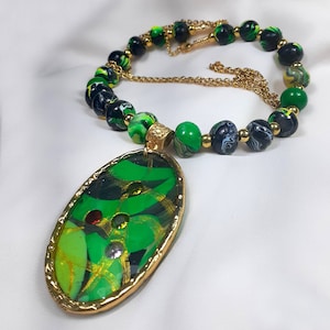 Unique handmade long necklace with polymer clay beads and stone detailed patterned oval pendant