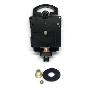 May include: Black clock movement with a copper winding, a gold-coloured mounting nut, and a black washer. The movement is designed for a clock with a 12-inch diameter face.